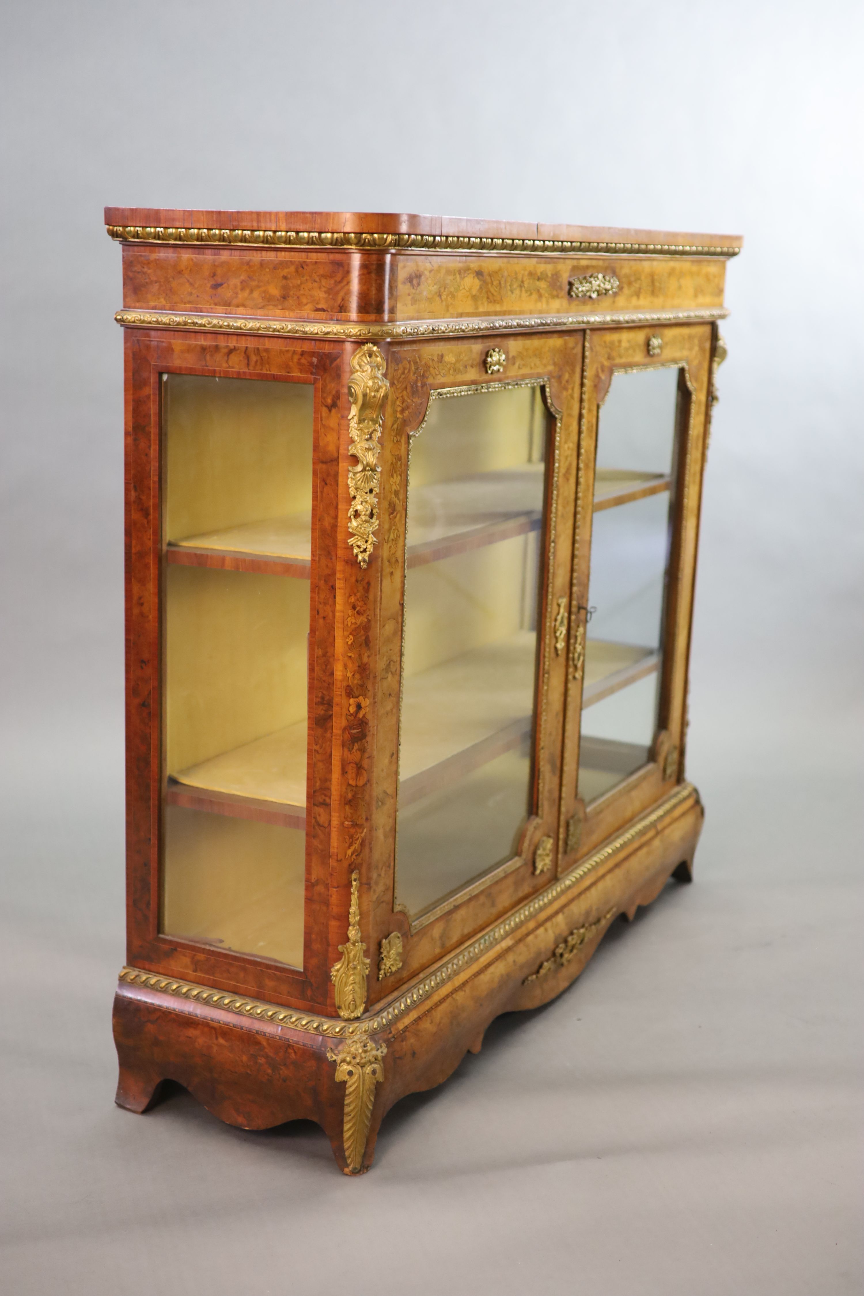 A Victorian ormolu mounted marquetry inlaid walnut bookcase, W.126cm D.38cm H.115cm